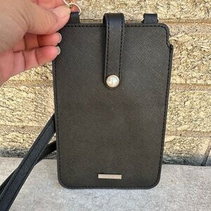 White House Black Market black faux leather crossbody bag with a pearl snap